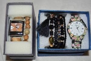 lot 595 image: (2) boxed Strada watches with complementing bracelets. One watch has Agate insets with matching stretch bracelet. Presented in gift boxes with booklets.