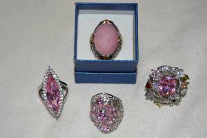 lot 614 image: (4) Stainless Steel Pink Quartz, Rose Quartz rings. Sizes (3)-9, Rose Quartz ring is size 10