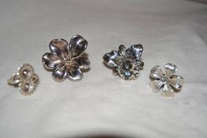 lot 611 image: (4) Sterling Silver filigree rings. All marked 925.  Largest one marked Israel. Sizes (3)-9, 10