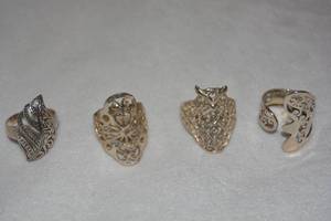 lot 609 image: (4) Sterling Silver filigree rings. All marked 925. Sizes (3)-9, 9.5