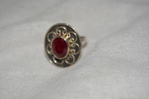 lot 591 image: Sterling Silver Ruby ring. Bezel set faceted ruby. Ruby tested. Approx. 4.0 carats. Marked 925. Size 9