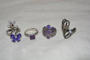 lot 632 image: (4) Polished stainless steel and glass gemstone rings. Includes Amethyst, African Amethyst, and marcasite. Marked 316L S. Steel)
