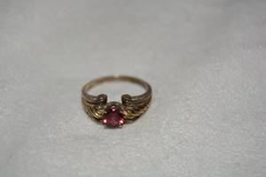 lot 589 image: Sterling Silver Garnet solitaire ring (probably Raspberry Rhodolite Garnet). Marked 925. Size 10