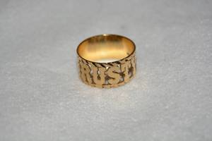 lot 588 image: 14K yellow gold negative space RUSTY cutout ring. Stamped 14K. Size 8.75