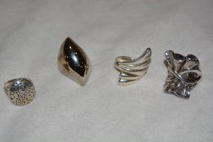 lot 608 image: (4) Sterling Silver modernist rings. All marked 925. Sizes 8.5, 9, 9.5, 10