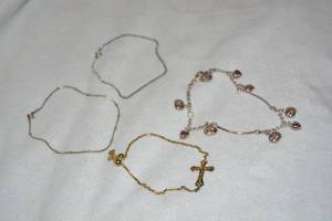 lot 603 image: (4) Sterling Silver bracelets. All marked 925. Two are marked 925 Italy. 2-9L, 1-10L, Cross bracelet is about 7.5L