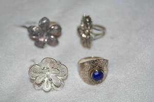 lot 634 image: (4) Sterling Silver rings. 2 are marked 925. Sizes (2)-9, (2)-9.5