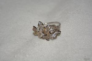 lot 641 image: Sterling Silver pave crystal ring in butterfly form. Marked 925. Size 10