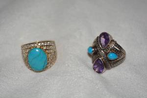 lot 625 image: (2) Sterling Silver and gemstone rings. Includes a vermeil (gold over sterling) Turquoise and white stone ring and a Turquoise and Amethyst ring. Both marked 925. Both size 9