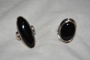 lot 606 image: (2) Sterling Silver Black Onyx rings. Both marked 925.  Both size 9.