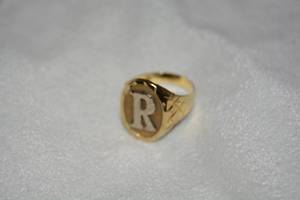 lot 647 image: Gold laser cut initial R ring. Marked 917 (22K). Gold not tested. Has very small dent on shank near bottom. (22K is very soft). Size 9.5