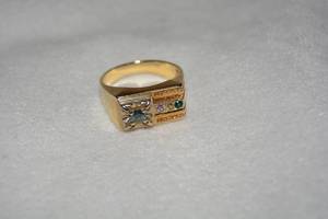 lot 644 image: Gold plated or vermeil (gold over sterling) Multi color Spinel ring. 3 of 4 gemstones test as Spinel. Dark green stone is glass. No markings. Size 10