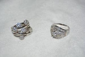 lot 648 image: (2) Polished stainless steel and CZ rings. Both size 9.
