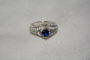 lot 655 image: Sterling Silver midnight Blue Sapphire and white stone ring. Sapphire tested. Marked 925. Size 9