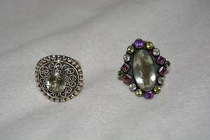 lot 630 image: (2) Sterling Silver Quartz rings. One has Blue Topaz and Amethyst accents. Gems tested. Both marked 925. Both size 9.