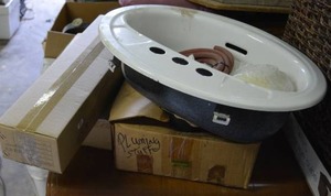 lot 581 image: Metal Sink, Plumbing Accessories, and Manual Drain Cleaner, and Box Marked Taillight for 97 Dodge truck