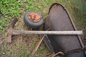 lot 661 image: Wheelbarrow and Pick Axe