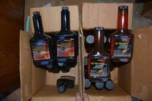 lot 534 image: Automotive Johnsons Oil Treatment and Fuel Injector
