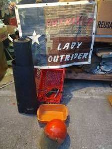 lot 662 image: Motorcycle Helmet, Red Crates, Tar Paper Roll, and Texas Flag Outrider Sign