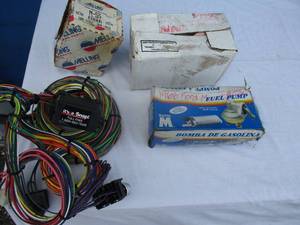 lot 85 image: Car Parts- 1966-Ford Mustang Fuel Pump, 1966-Chev, Red Tail Lamp, M-55 New Generation Oil Pump, Its A Snap Wire Harness