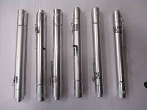 lot 94 image: NEW-6-- 5.5 BLUE LED Uv-LIGHT, ALUMINUM -PENLIGHT FLASHLIGHTS, WITH PUSH BUTTON ONOFF AND POCKET CLIP.