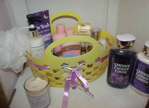 lot 27 image: womens skin care lot  Beautiful Wrapped Basket (Perfect for Gifting with a Generous Variety of Shower Gels, Lotions, and Perfumes