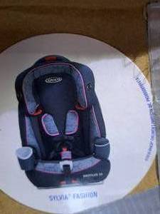 lot 150 image: Graco Natilus 65 3 in 1 car seat, NEW IN BOX extra cover.