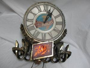 lot 29 image: VINTAGE- SCHLITZ Wall Clock, Needs TLC.