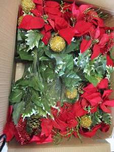 lot 79 image: About 12- Red Poinsettia Mixed Holiday Floral Bouquets. Note12 X The Money