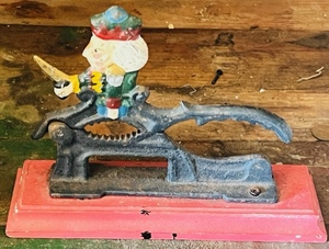 lot 28 image: 7x6 Vintage Cast Iron Nut Cracker on Wooden Stand