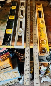 lot 73 image: Three Vintage Stanley Aluminum Levels &amp Two 36 Metal Rulers
