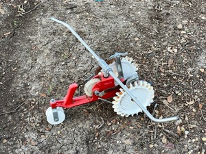 lot 176 image: Vintage Red &amp White Cast Iron Thompson Traveling Lawn Sprinkler Tractor