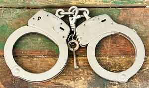 lot 292 image: Vintage Set of Smith &amp Wesson M-100 Handcuffs