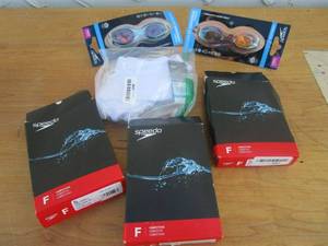 lot 167 image: SPEEDO SWIM LOT, (2) SETS OF COMPETITIVE GOGGLES, YOUTH & WOMENS COMPETITIVE SWIMWEAR SUITS W TAGS