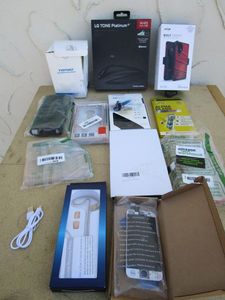 lot 56 image: LG TONE PLATINUM HEADPHONES, RUGGED PHONE CASES, CUP HOLDER PHONE MOUNT, SCREEN PROTECTORS, MINI EAR-HANGING MICROPHONE, REPAIR KIT (NO BOX)
