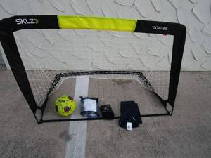 lot 210 image: SKLZ FOLDING SOCCER NET, WILSON NCAA SOCCER BALL, ADIDAS KNEE HIGH SOCKS, NIKE KNEE HIGH SOCKS, TIGHT UNDER SHORTS,