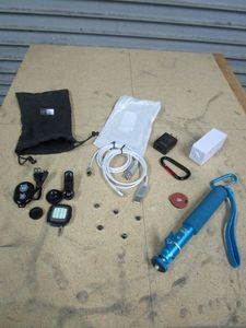 lot 240 image: 6-IN-1 MAGNETIC PHONE CHARGER, CAMERA LENS & FLASH KIT FOR PHONE, TRACKR BRAVO, MERKURY BLUTOOTH WALL OUTLET, XS XSERIES SELFIE STICK