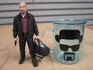lot 254 image: BREAKING BAD BEAKER GLASS MUG, WALTER WHITE HYPER-REALISTIC FIGURINE W DUFFLE BAG OF CASH