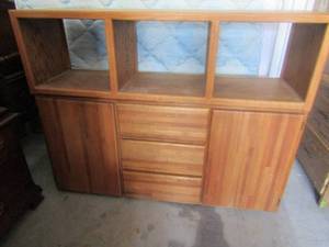 lot 32 image: 2 piece tv entertainment center, 2 doors 3 drawers on bottom, top has 2 cabinets, 46 by 59 by 18