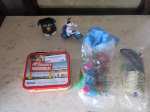 lot 83 image: Mcdonalds happy meal toys, FURBY, slinky dogs, 101 dalmatians, mini metal McDonalds lunch box