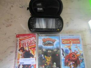 lot 17 image: PSP game system with 2 batteries in case, 3 games with charger