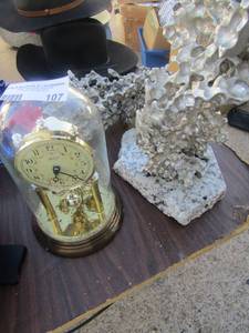 lot 107 image: Mikasa quarts clock with glass cover  metal sculpture
