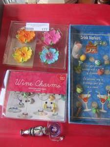 lot 177 image: Wine charms and Drink makers , Island paradise table weights