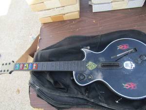 lot 212 image: Gibson guitar hero in bag