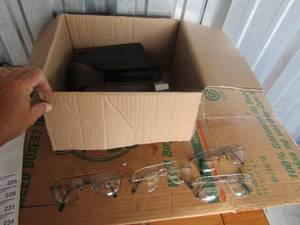 lot 224 image: Box full of eyeglasses and cases