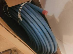 lot 107 image: Roll of 34 pex-type pipe
