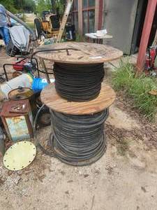 lot 197 image: Spool of heating hose, and spool of cable