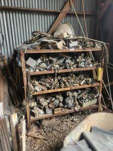 lot 213 image: Metal shelf with contents - lots of parts - carburetors and more