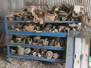 lot 221 image: Metal shelf with contents - has a few high dollar aircraft starter generators