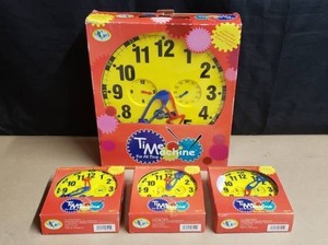 lot 46 image: Time Machine 1 Teacher Clock & 3 Student Clocks